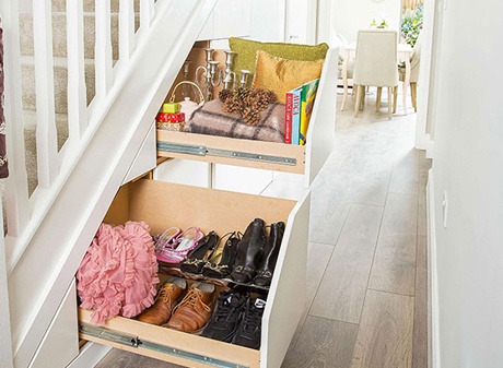 Hideaway storage drawers under staircase