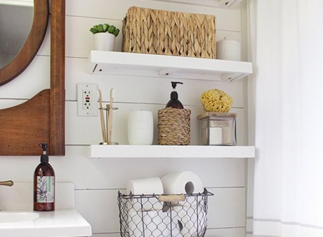 Floating white bathroom shelves