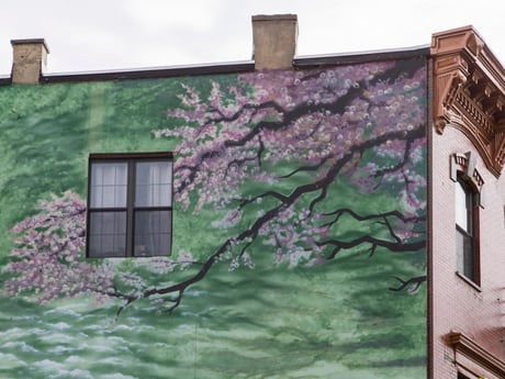 Jersey City Mural on Newark Avenue titled Cherry Blossoms and Train Tracks by Blair Urban