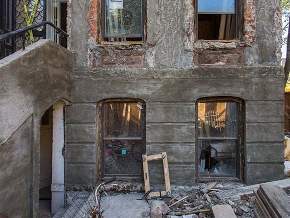 rundown brownstone facade